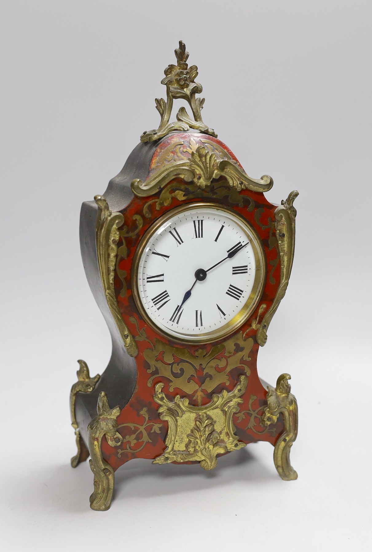 A late 19th century Boulle work mantel timepiece with key, 31cms high